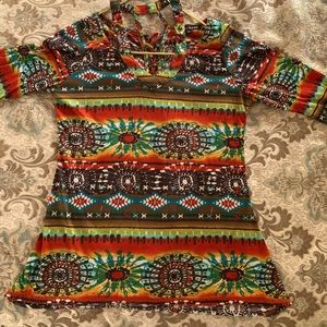 It’s all in the details!Trendy top features lace up back and cutout shoulders